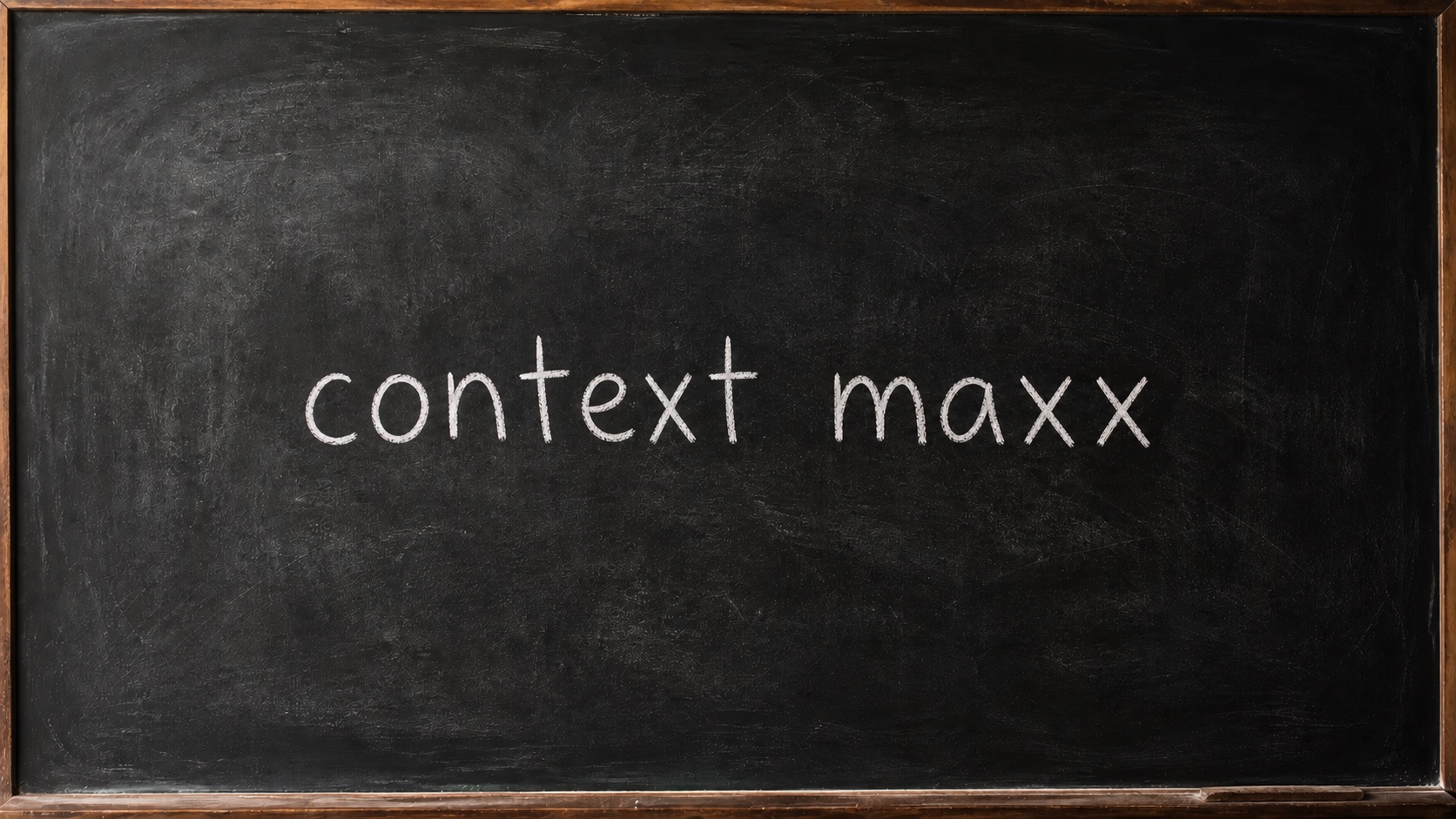 The words “context maxx” written in chalk on a blackboard